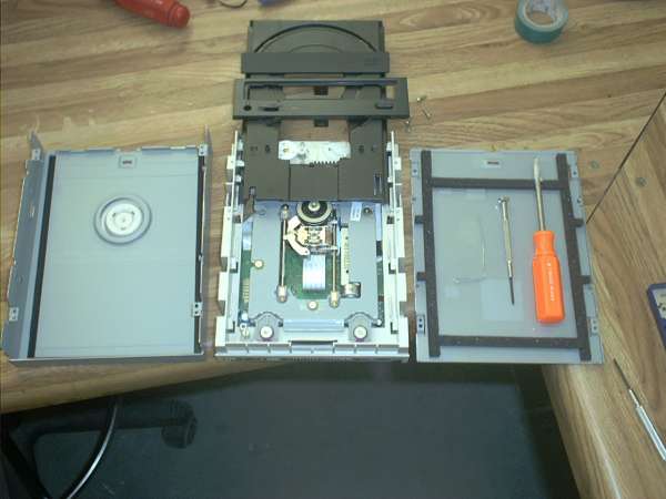 The externally mounted CD-ROM is to be painted and further camouflaged with a decorative wood panel.